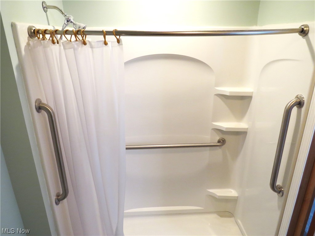 10130 Lee Road Minerva, OH 44657 - Photo 17 of 35 Large walk in shower in Main bedroom. grab bars and easy access.