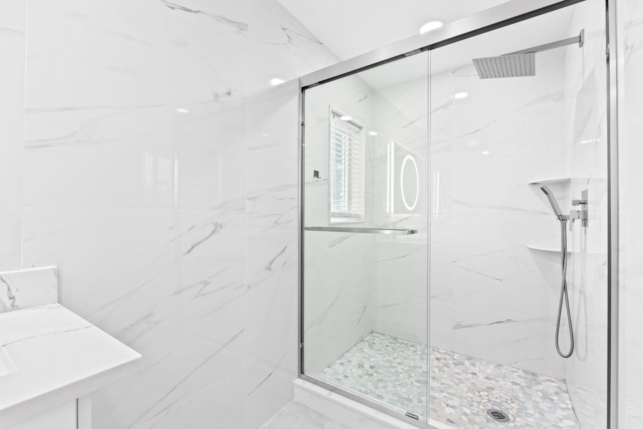 12293 Old Country Road South Wellington, FL 33414 - Photo 16 of 32 a bathroom with a glass shower door