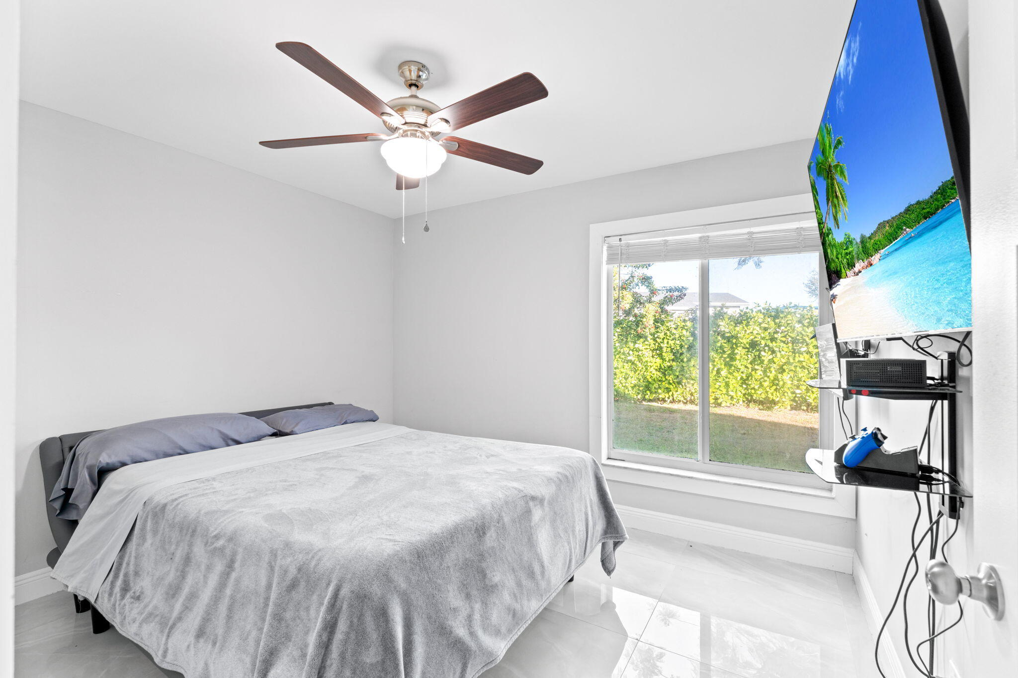 12293 Old Country Road South Wellington, FL 33414 - Photo 19 of 32 a bedroom with a bed and a large window