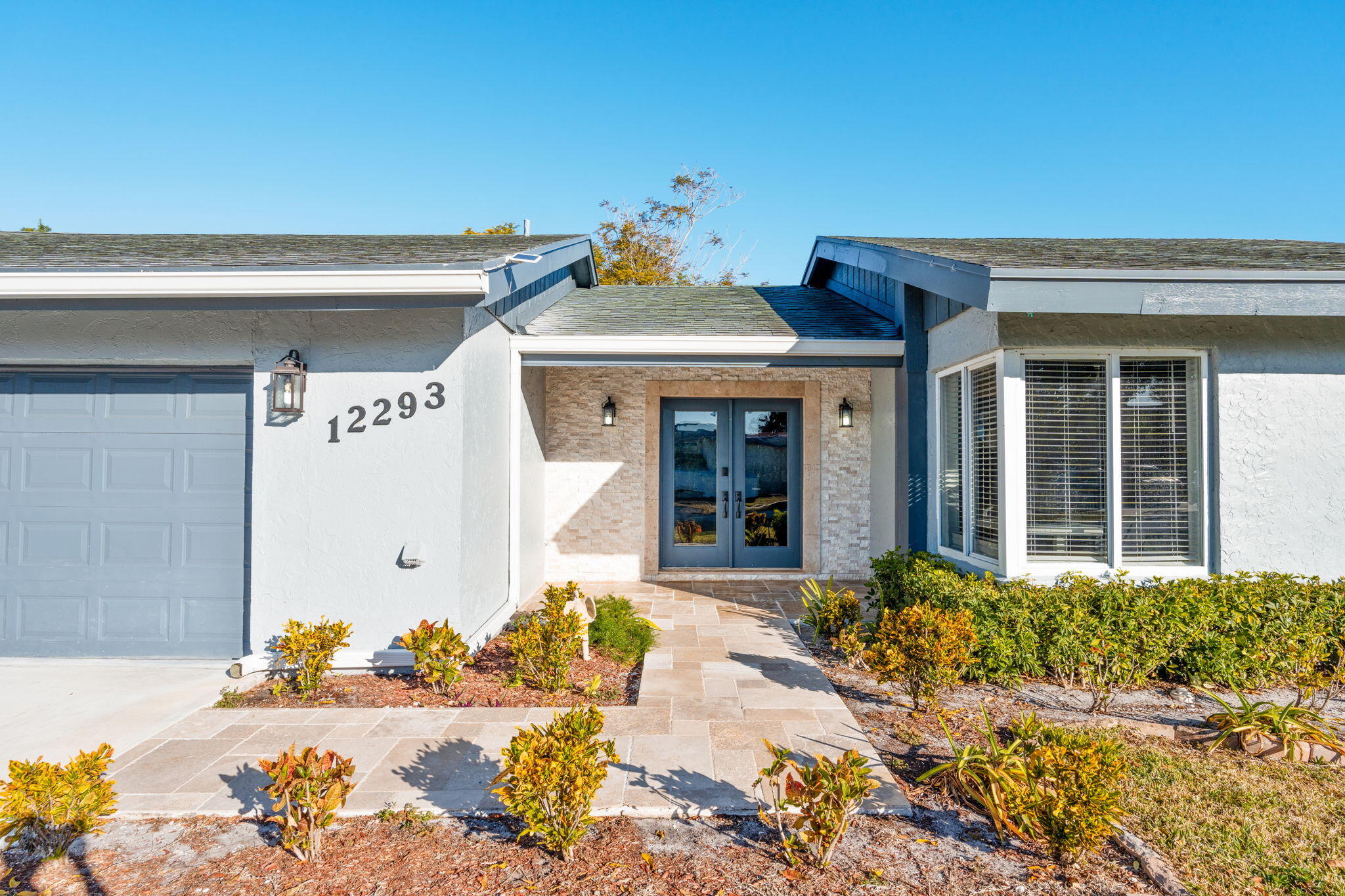 12293 Old Country Road South Wellington, FL 33414 - Photo 2 of 32 a front view of a house
