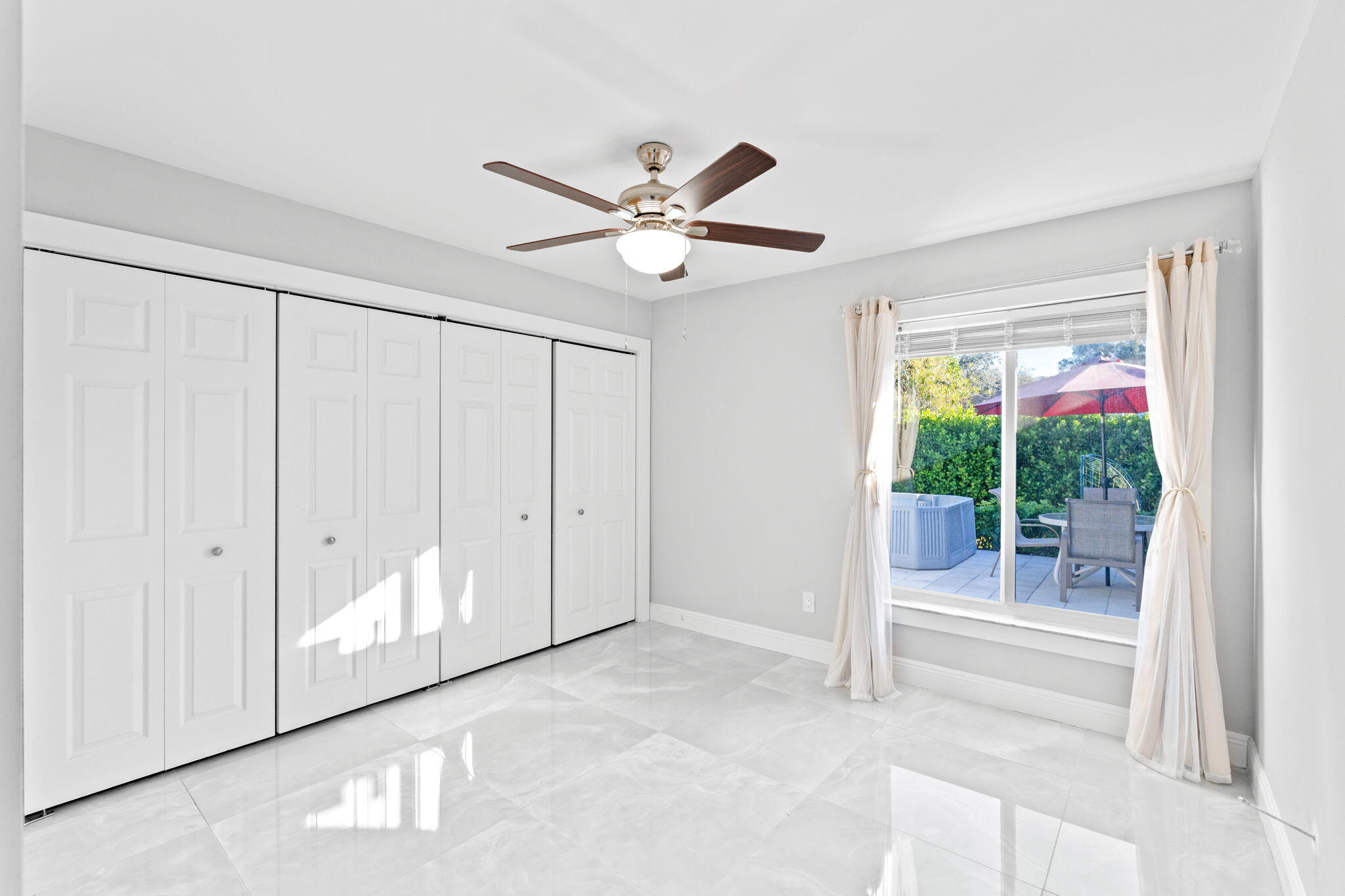 12293 Old Country Road South Wellington, FL 33414 - Photo 21 of 32 a view of a livingroom with a ceiling fan and window
