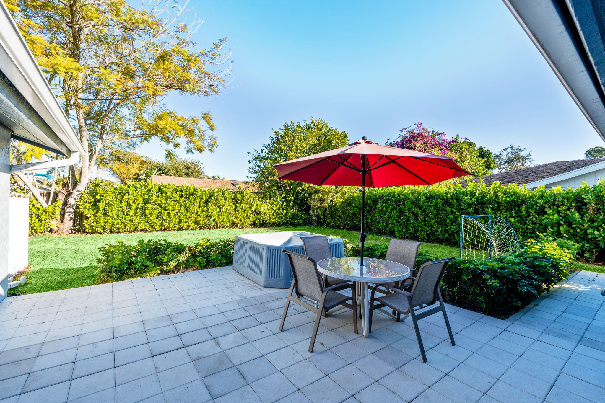 12293 Old Country Road South Wellington, FL 33414 - Photo 24 of 32 an outdoor space with furniture and umbrella