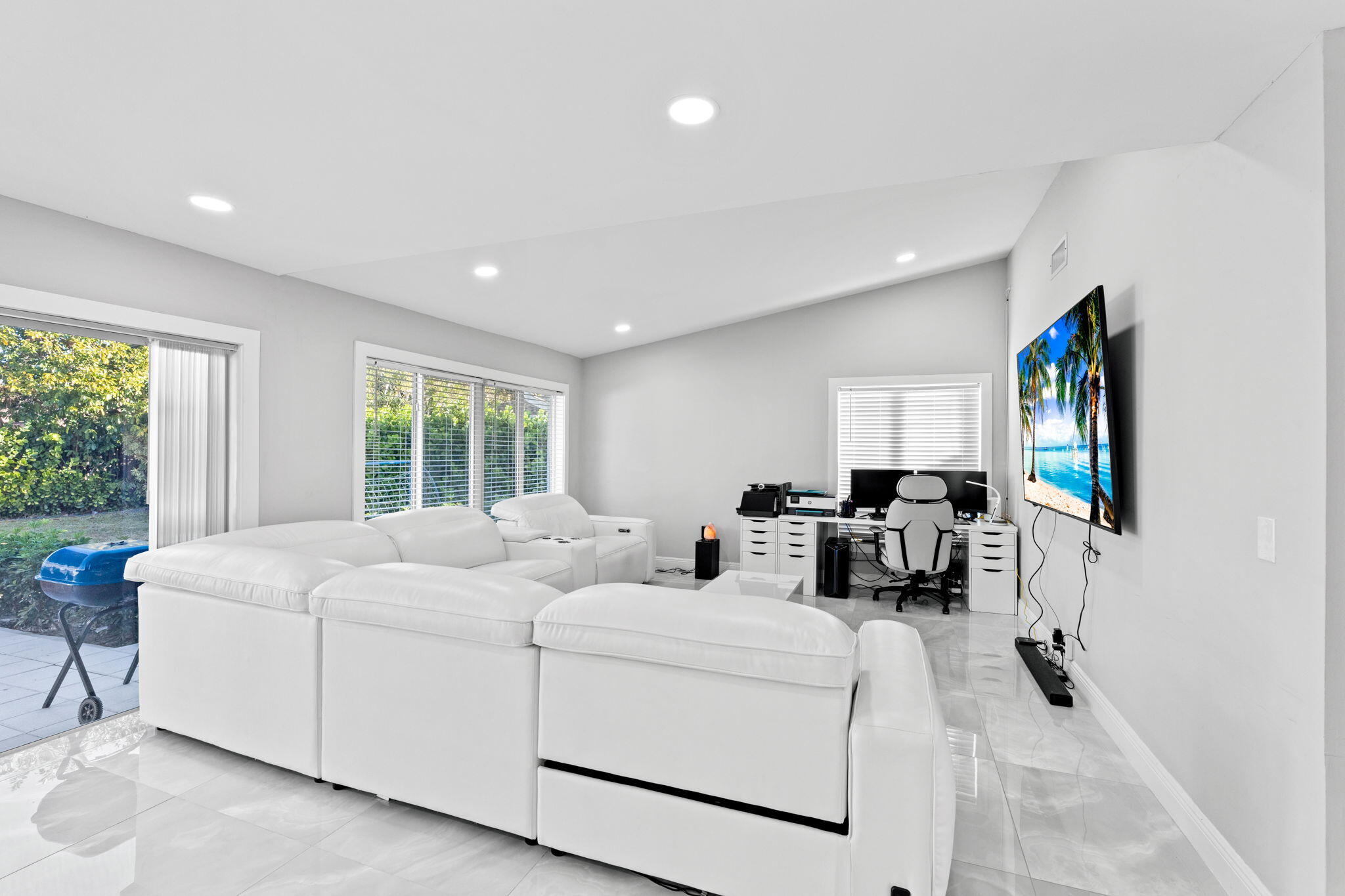 12293 Old Country Road South Wellington, FL 33414 - Photo 5 of 32 a living room with furniture a flat screen tv and a large window