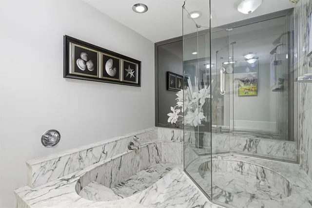 a view of a lake with tall building in the background