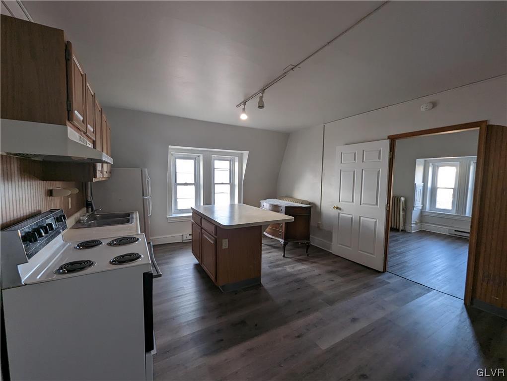168 West Main Street, Unit 3F Kutztown, PA 19530 - Photo 2 of 12 a kitchen with furniture a stove and a wooden floor