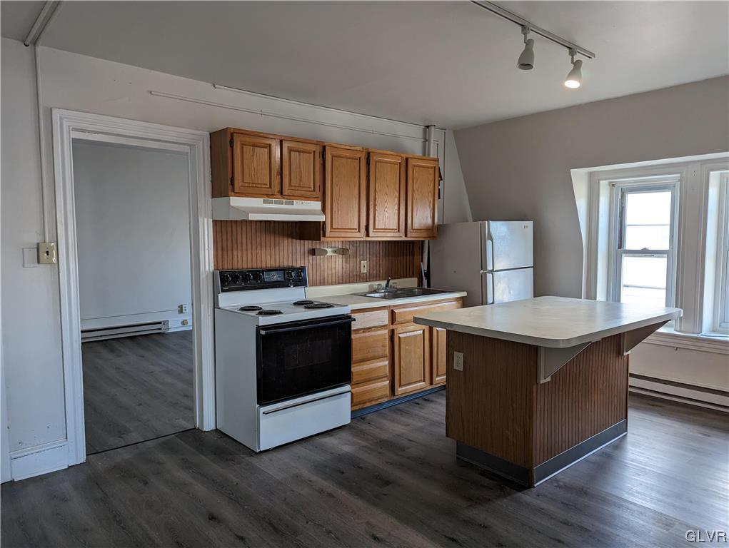 168 West Main Street, Unit 3F Kutztown, PA 19530 - Photo 3 of 12 a kitchen with stainless steel appliances granite countertop a stove a sink and a refrigerator