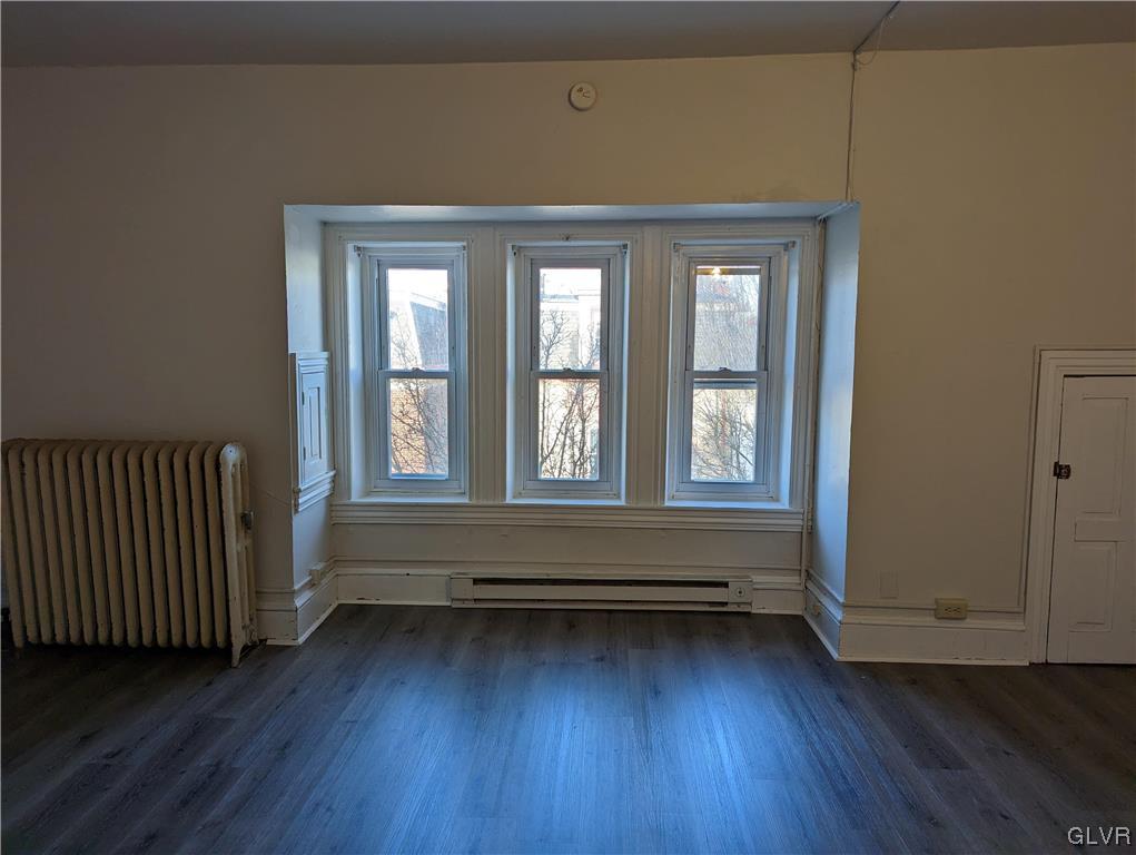 168 West Main Street, Unit 3F Kutztown, PA 19530 - Photo 5 of 12 a living room with wooden floor and large window