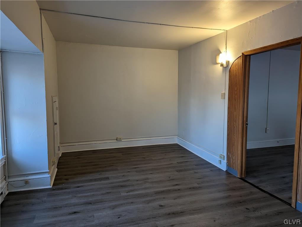 168 West Main Street, Unit 3F Kutztown, PA 19530 - Photo 7 of 12 a view of an empty room with wooden floor