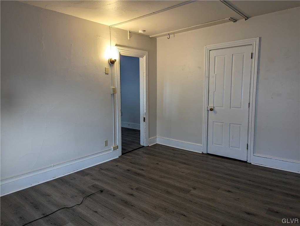 168 West Main Street, Unit 3F Kutztown, PA 19530 - Photo 8 of 12 a view of an empty room with wooden floor