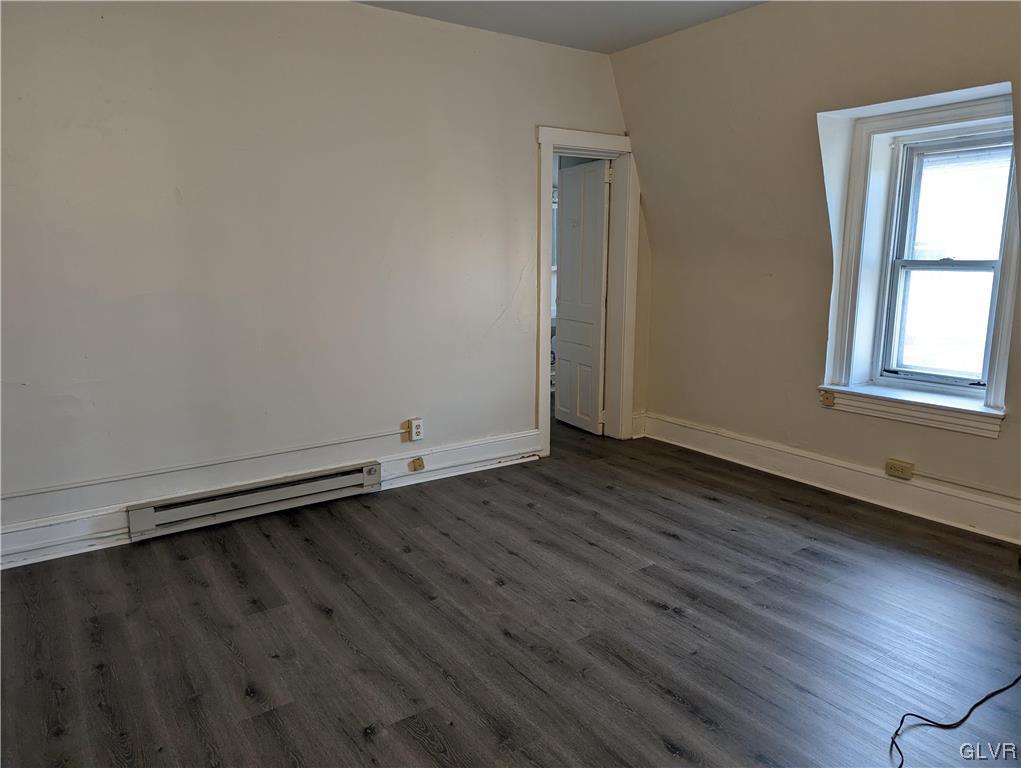 168 West Main Street, Unit 3F Kutztown, PA 19530 - Photo 9 of 12 an empty room with wooden floor and windows