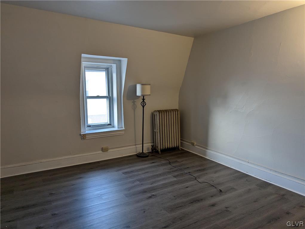 168 West Main Street, Unit 3F Kutztown, PA 19530 - Photo 10 of 12 an empty room with wooden floor and windows