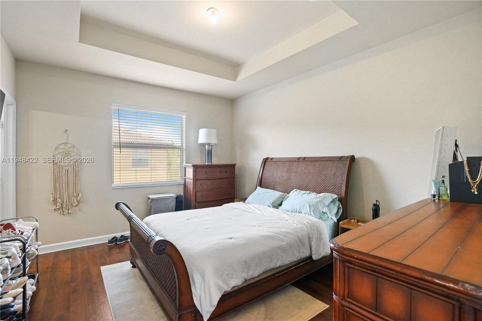 9105 Southwest 227th Street, Unit 9 Cutler Bay, FL 33190 - Photo 11 of 37 a bedroom with bed and window