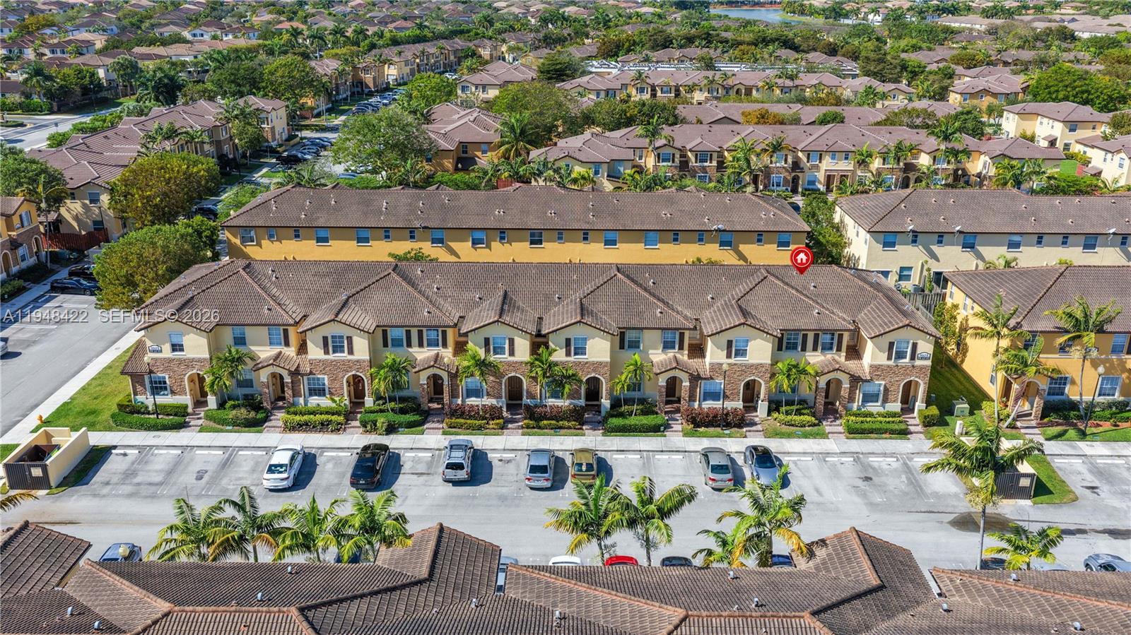 9105 Southwest 227th Street, Unit 9 Cutler Bay, FL 33190 - Photo 27 of 37 an aerial view of multiple house