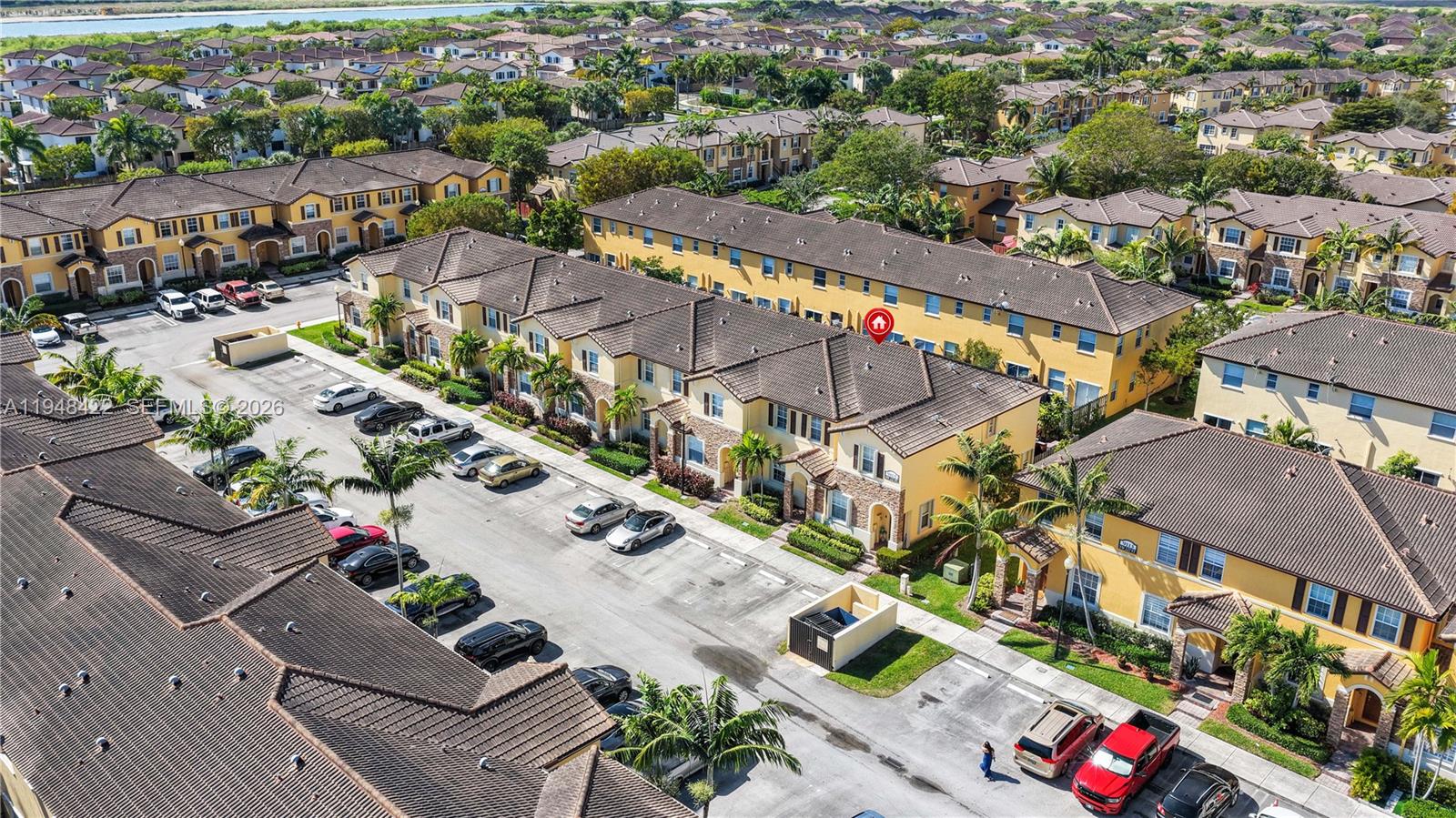 9105 Southwest 227th Street, Unit 9 Cutler Bay, FL 33190 - Photo 28 of 37 an aerial view of a city