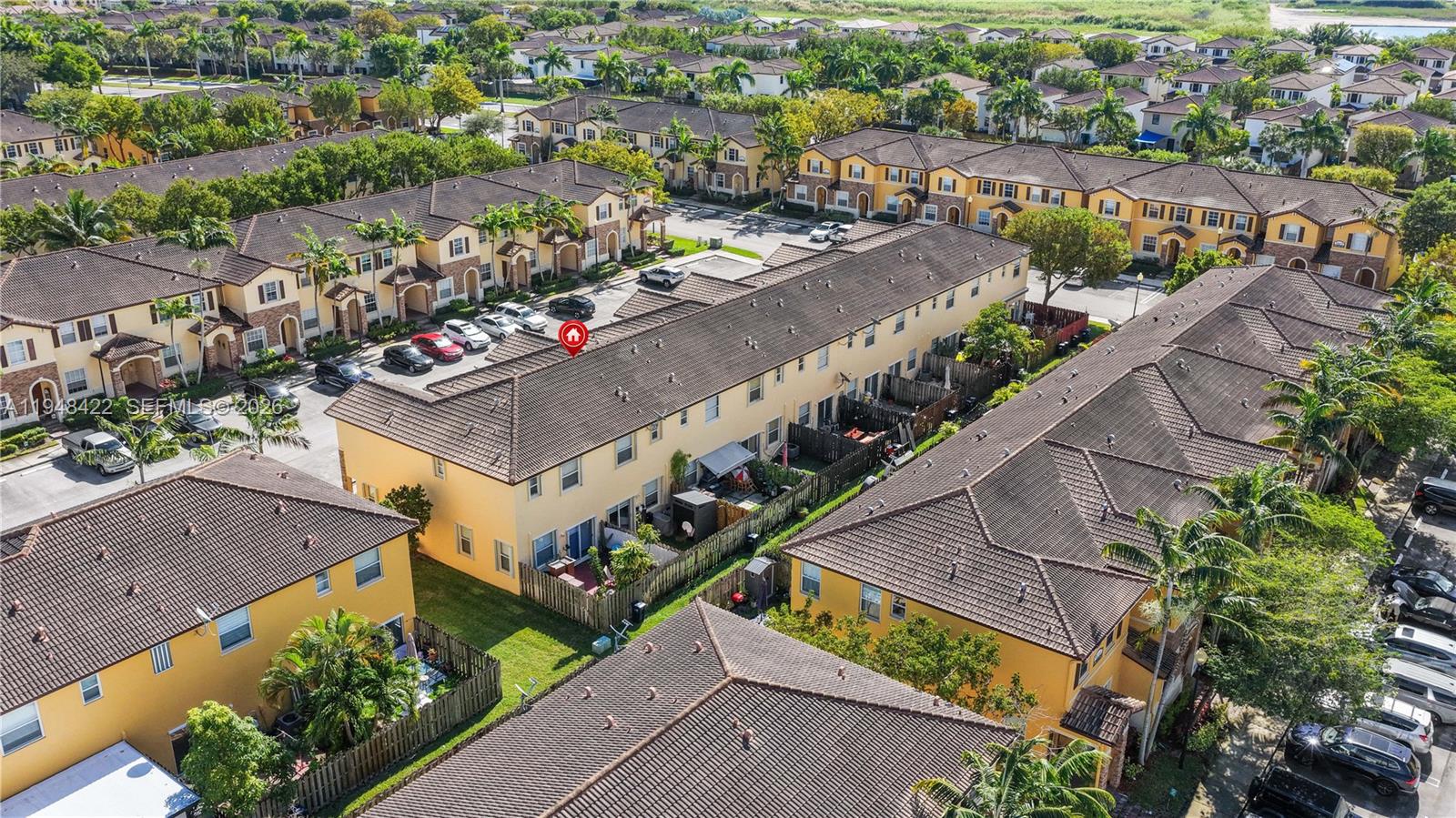 9105 Southwest 227th Street, Unit 9 Cutler Bay, FL 33190 - Photo 29 of 37 an aerial view of a city