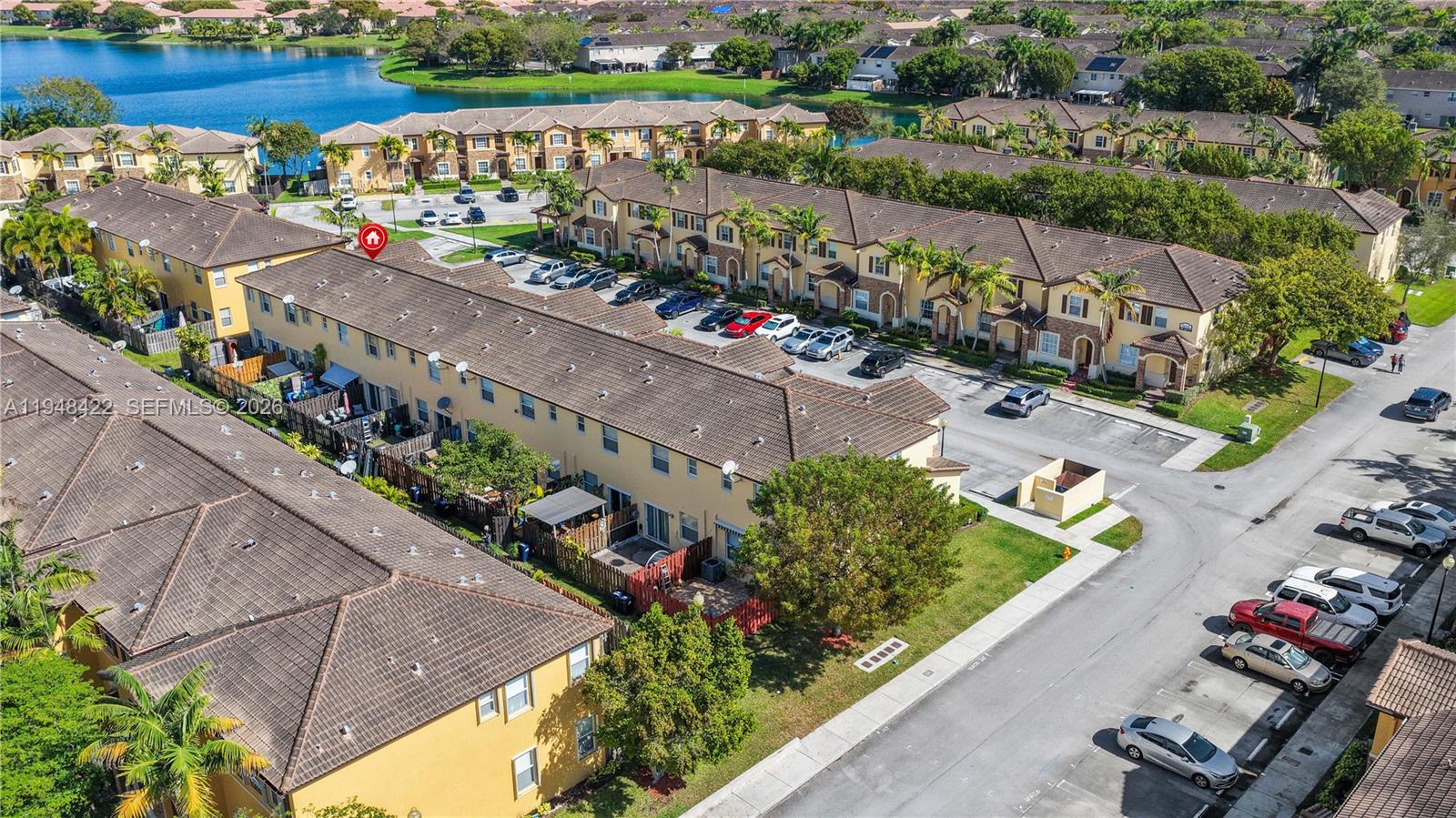 9105 Southwest 227th Street, Unit 9 Cutler Bay, FL 33190 - Photo 30 of 37 an aerial view of a city and mountain view in back