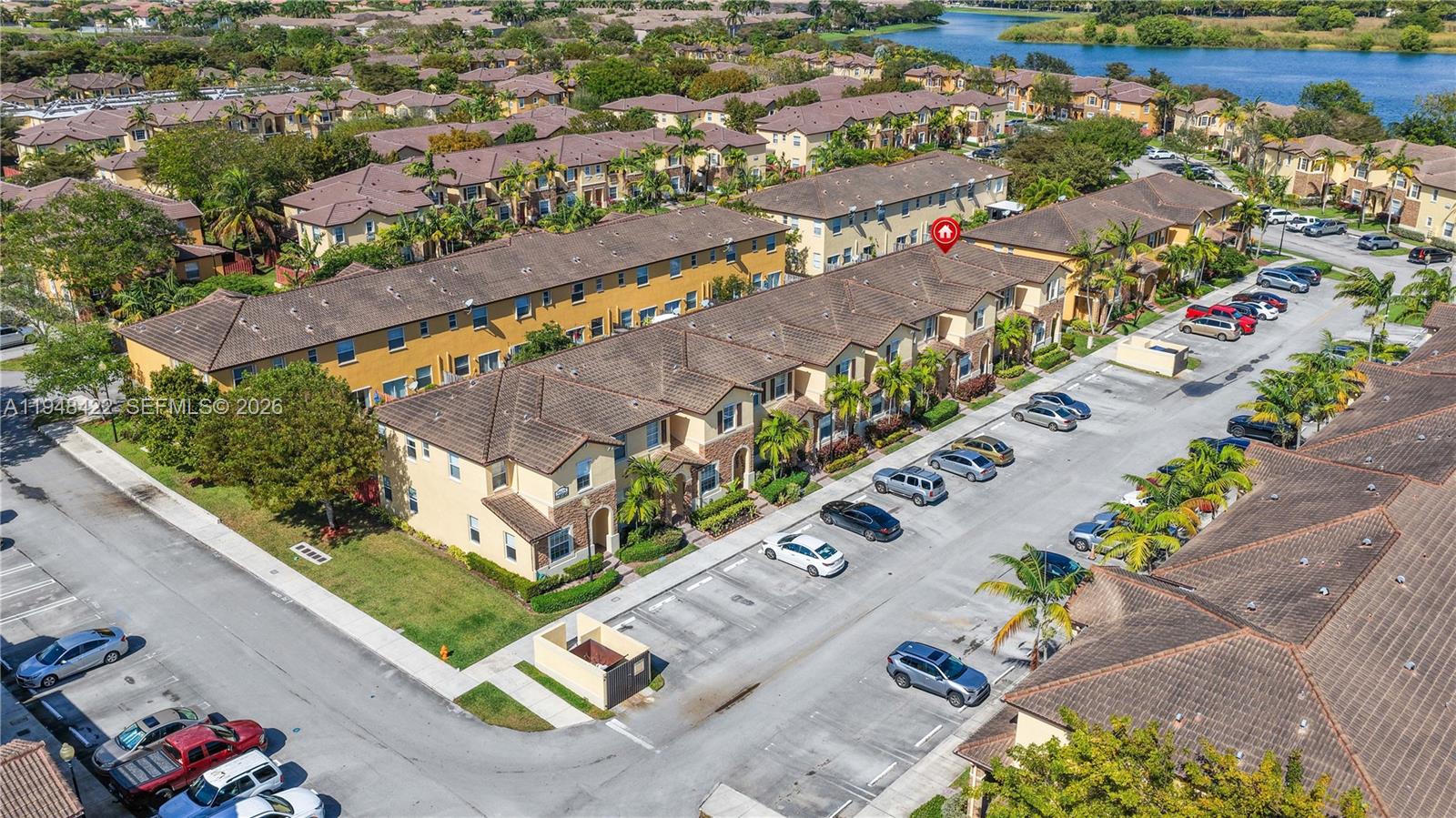 9105 Southwest 227th Street, Unit 9 Cutler Bay, FL 33190 - Photo 32 of 37 an aerial view of a city