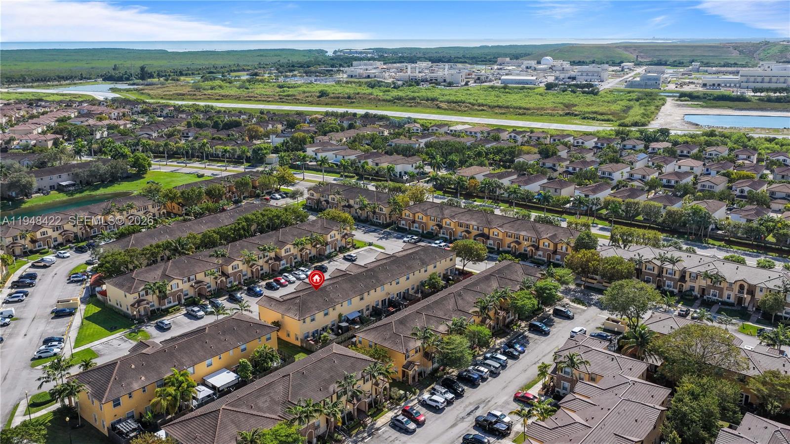 9105 Southwest 227th Street, Unit 9 Cutler Bay, FL 33190 - Photo 34 of 37 a view of city and ocean