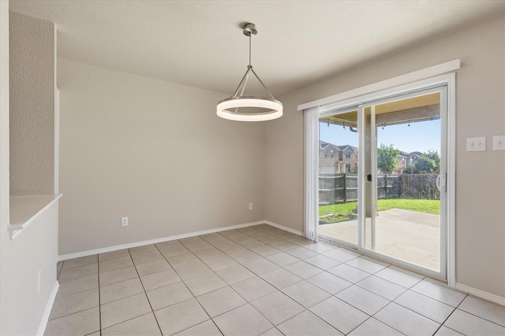 7708 Boat Wind Road Fort Worth, TX 76179 - Photo 7 of 23 Dining Area with sliding door and built in shelving