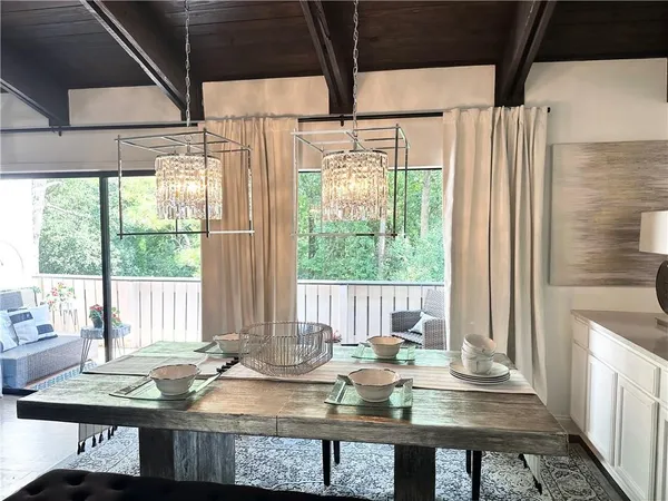 a view of a dining room with furniture window and outside view