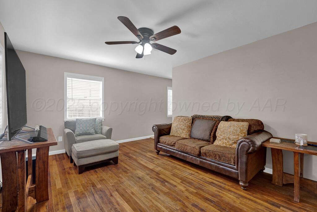 312 Southwest 45th Avenue Amarillo, TX 79110 - Photo 11 of 23 a living room with furniture flat screen tv and a window