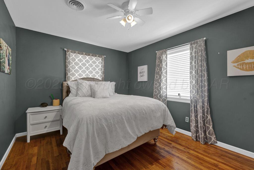 312 Southwest 45th Avenue Amarillo, TX 79110 - Photo 12 of 23 a bedroom with a bed and a window