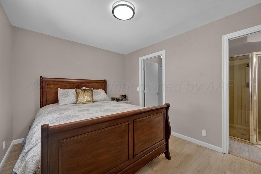 312 Southwest 45th Avenue Amarillo, TX 79110 - Photo 15 of 23 a bedroom with a bed and a dresser