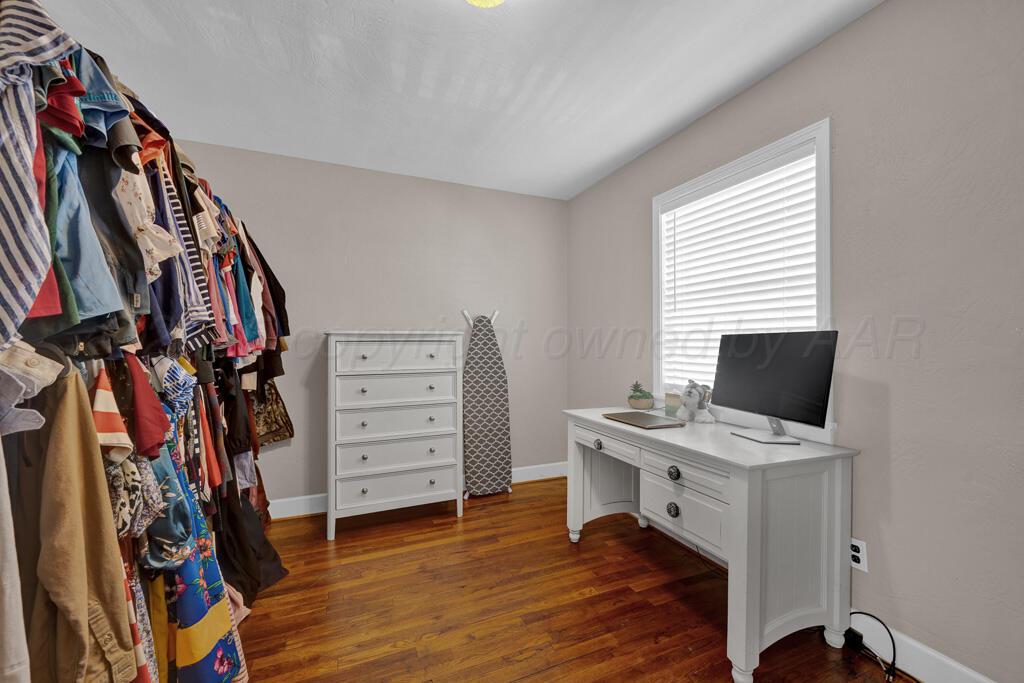 312 Southwest 45th Avenue Amarillo, TX 79110 - Photo 18 of 23 a view of a workspace with furniture and a window