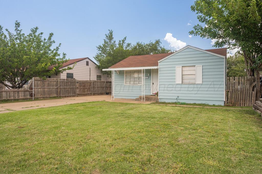 312 Southwest 45th Avenue Amarillo, TX 79110 - Photo 3 of 23 a view of a house with a backyard