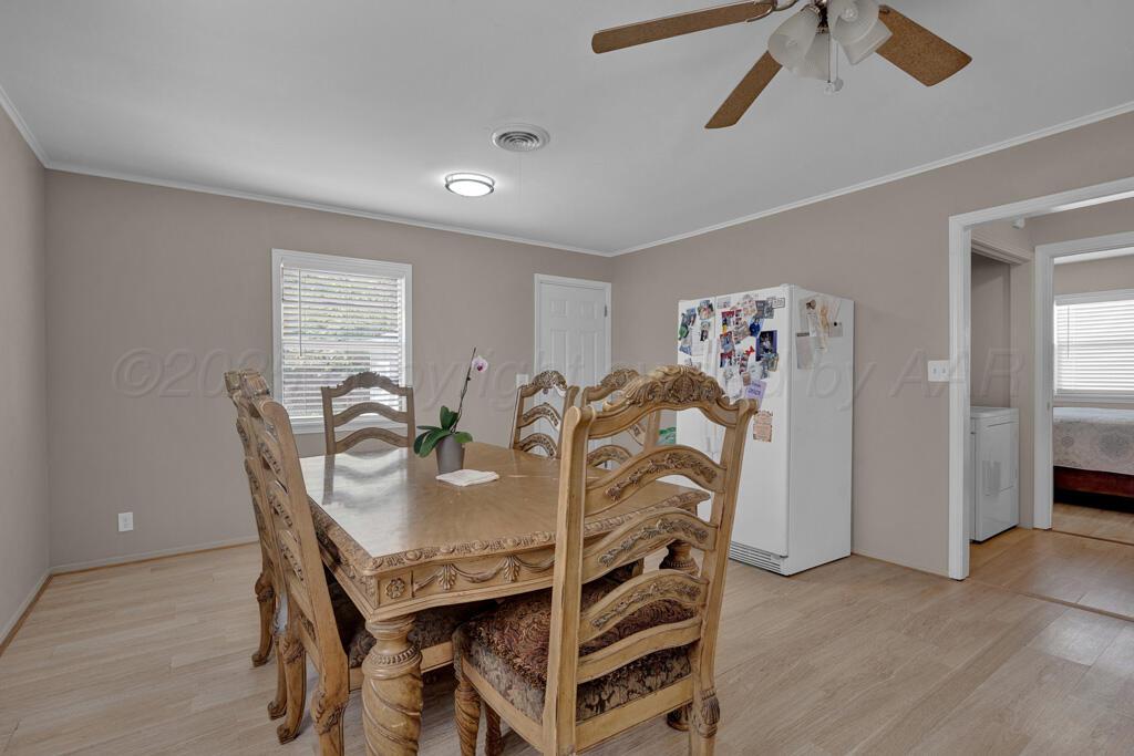 312 Southwest 45th Avenue Amarillo, TX 79110 - Photo 8 of 23 a view of a dining room with furniture