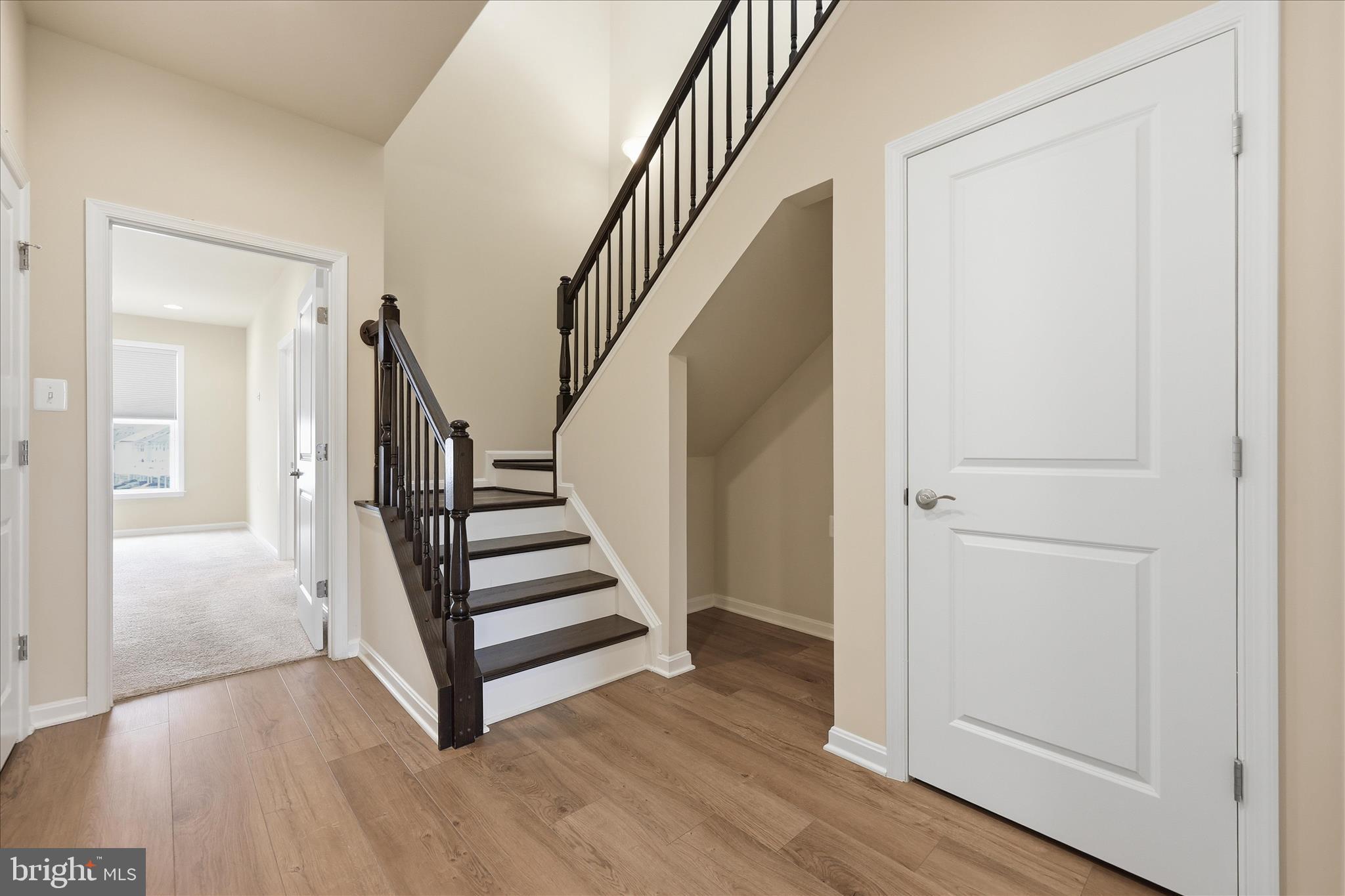 1090 Holden Road Frederick, MD 21701 - Photo 17 of 60 a view of a hallway with wooden floor and entryway