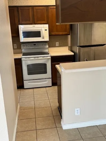 a kitchen with a stove and a microwave