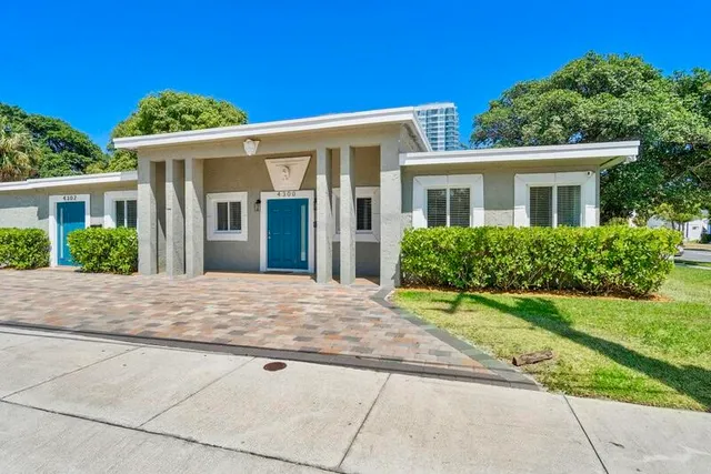 front view of a house with a yard