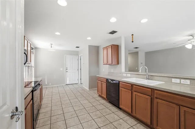 a spacious bathroom with a sink a mirror and a shower
