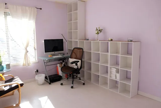 a workspace with furniture and a window