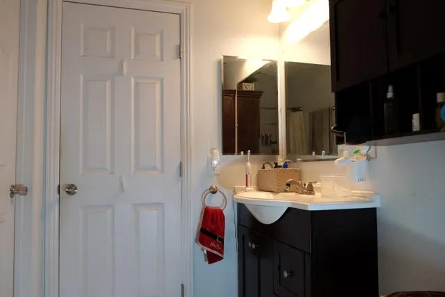 a bathroom with a sink and a mirror