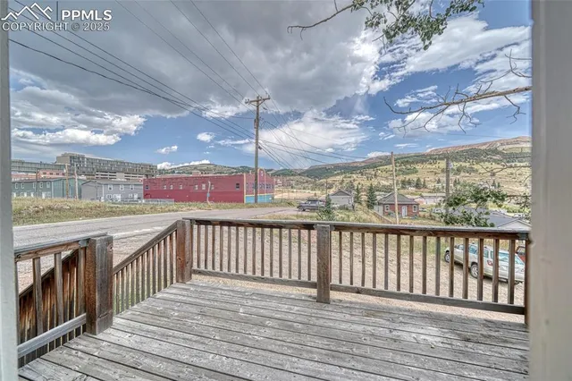 a view of a wooden house with a door and wooden floor