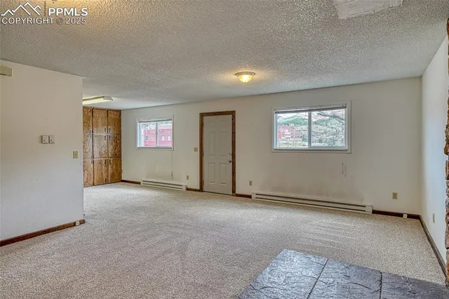 a view of a dining room with furniture and window