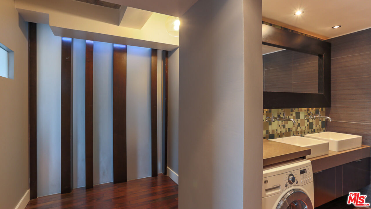 7250 Franklin Avenue, Unit 1112 Los Angeles, CA 90046 - Photo 15 of 29 a bathroom with a sink and a mirror