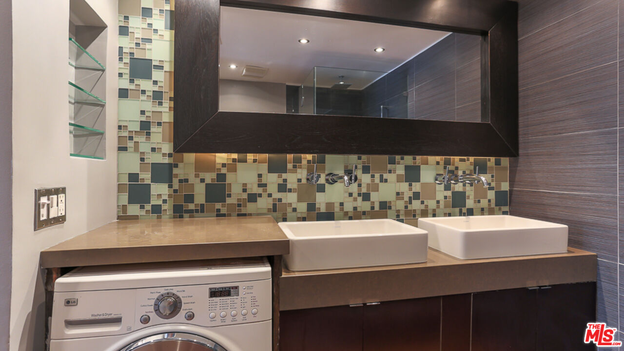 7250 Franklin Avenue, Unit 1112 Los Angeles, CA 90046 - Photo 16 of 29 a kitchen with a sink and cabinets