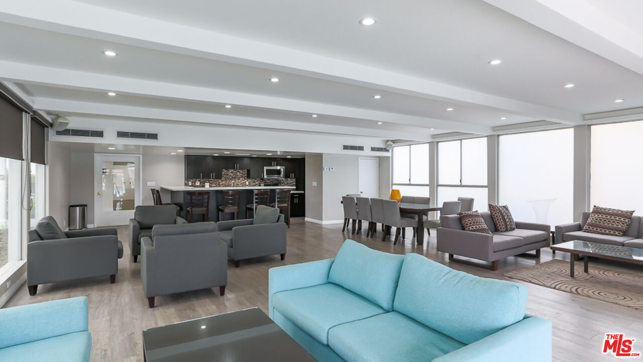 7250 Franklin Avenue, Unit 1112 Los Angeles, CA 90046 - Photo 20 of 29 a living room with furniture and a view of kitchen