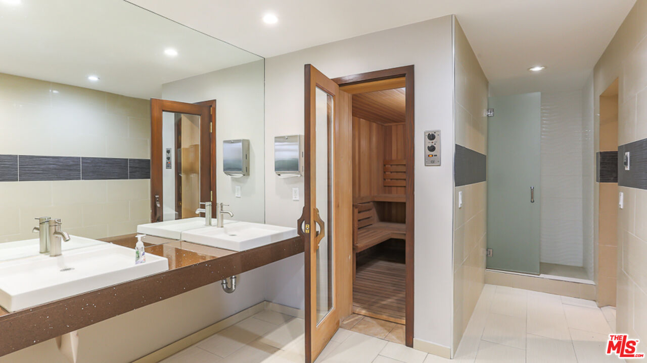 7250 Franklin Avenue, Unit 1112 Los Angeles, CA 90046 - Photo 22 of 29 a bathroom with a sink and a mirror
