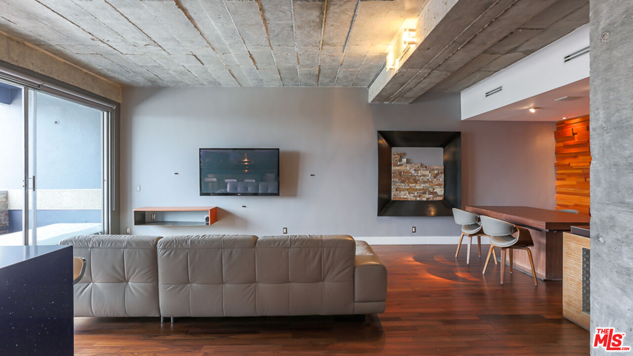 7250 Franklin Avenue, Unit 1112 Los Angeles, CA 90046 - Photo 5 of 29 a living room with furniture and a flat screen tv