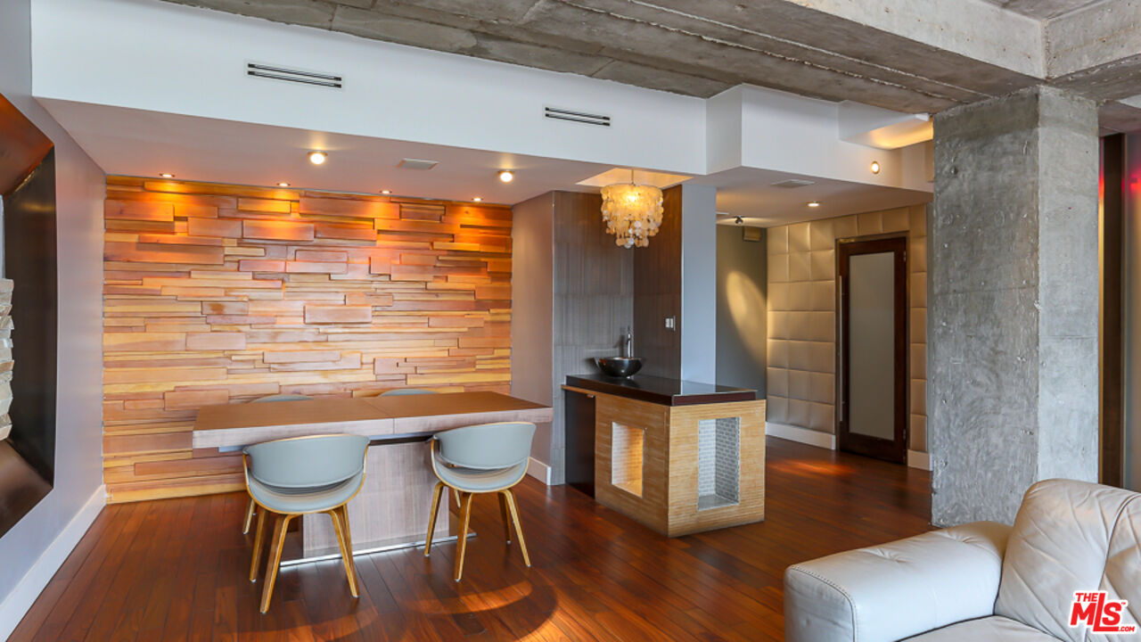 7250 Franklin Avenue, Unit 1112 Los Angeles, CA 90046 - Photo 7 of 29 a view of a dining room with furniture and wooden floor