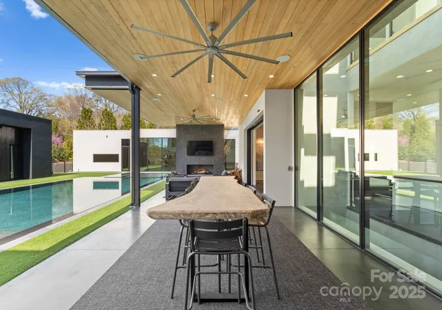 a dining area with a table and chairs