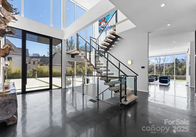 a view of entryway and hall with dining area