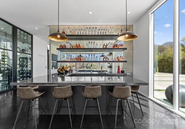 a kitchen with a table and chairs in it