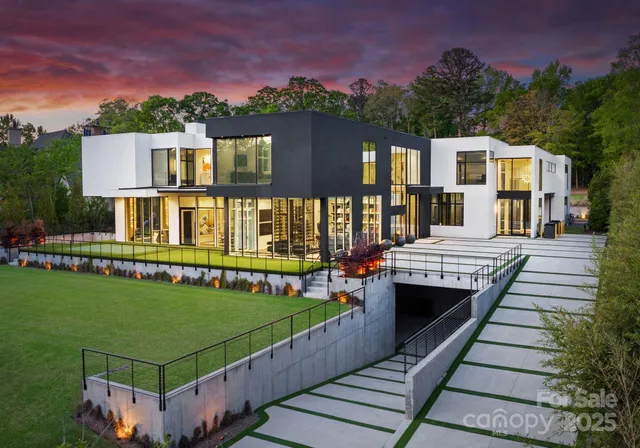 a view of a house with a yard and sitting area