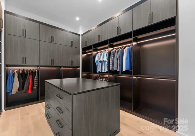 a kitchen with stainless steel appliances granite countertop a refrigerator and a stove