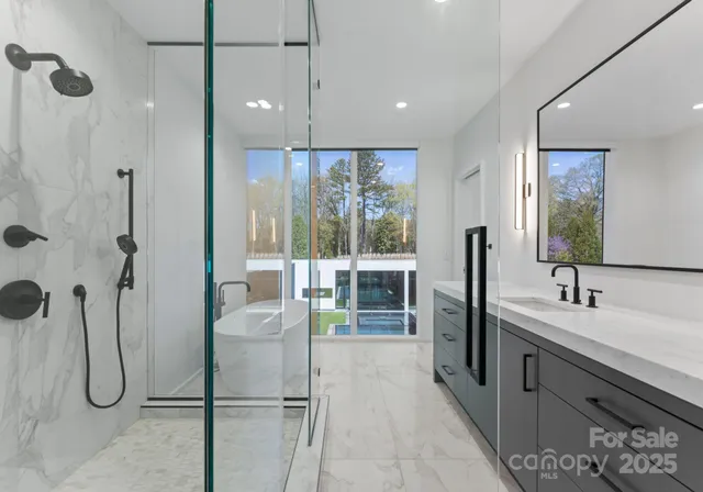 a bathroom with a double vanity sink a mirror and a shower